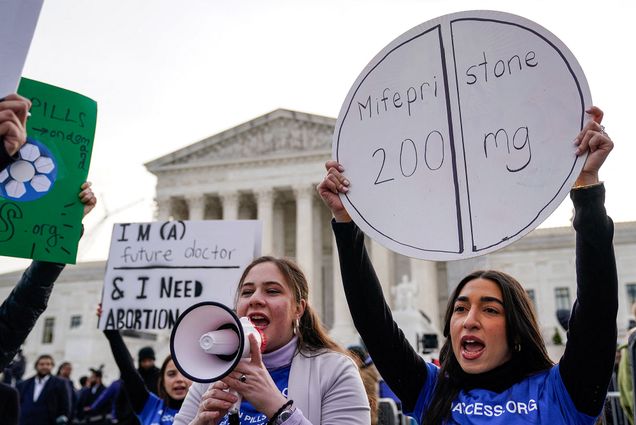 Photo: Pro-abortion rights activist rally in front of the US Supreme Court on March 26, 2024, in Washington, DC. A woman holding a sign in the shape of an abortion pill that reads "Mifepristone 200mg"