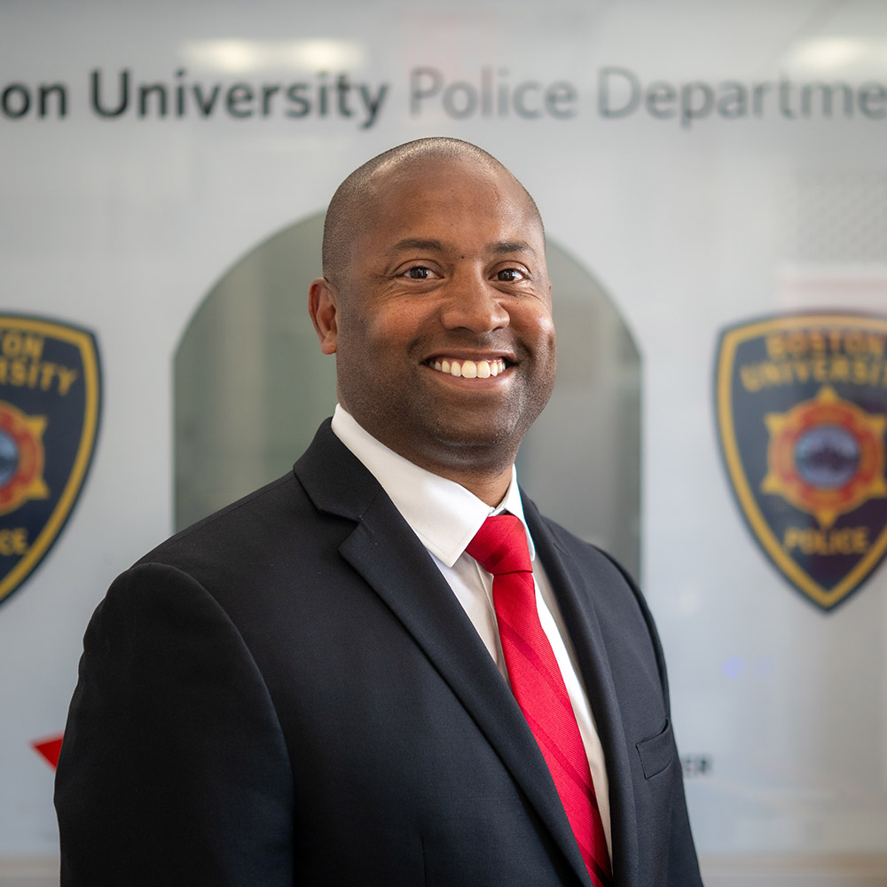 Photo: Robert Lowe, a Black man in black suit and a red tie, will be the new BUPD chief.