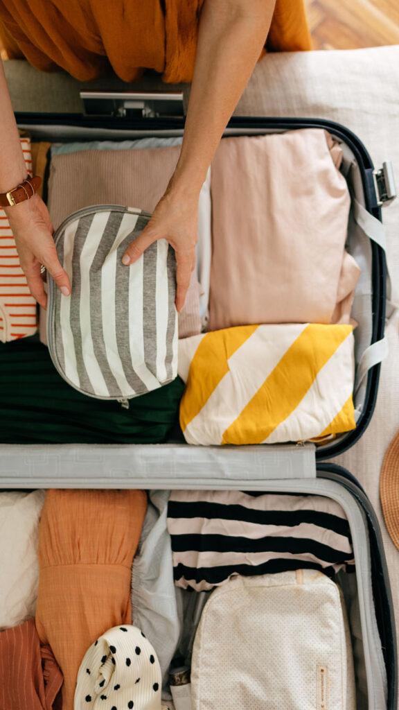 Photo: A picture of someone packing and organizing a suitcase for vacation