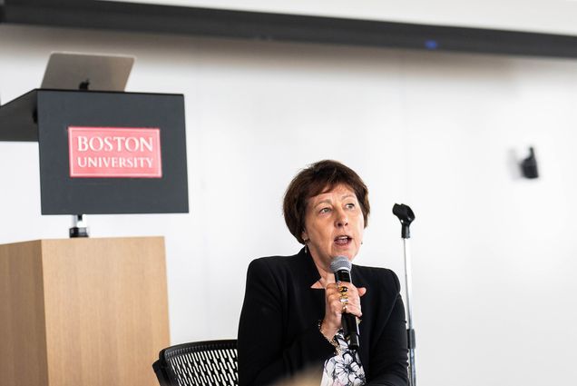 Photo: Dr. Nicky Fox, a white woman with short brown hair and blazer, the Associate Administrator for the Science Directorate at NASA talks with CSP-affiliated students and faculty