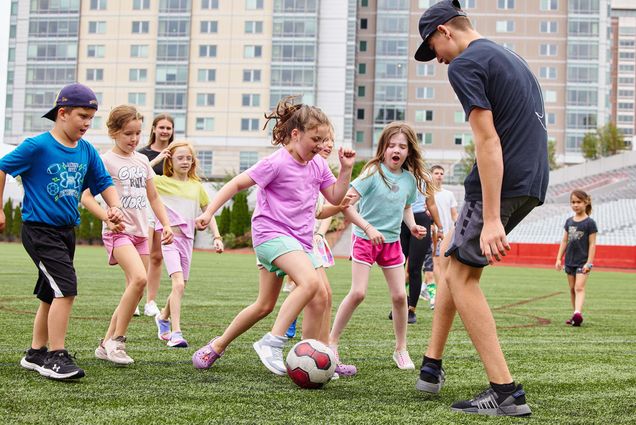 Photo: A picture of children playing soccer on a field