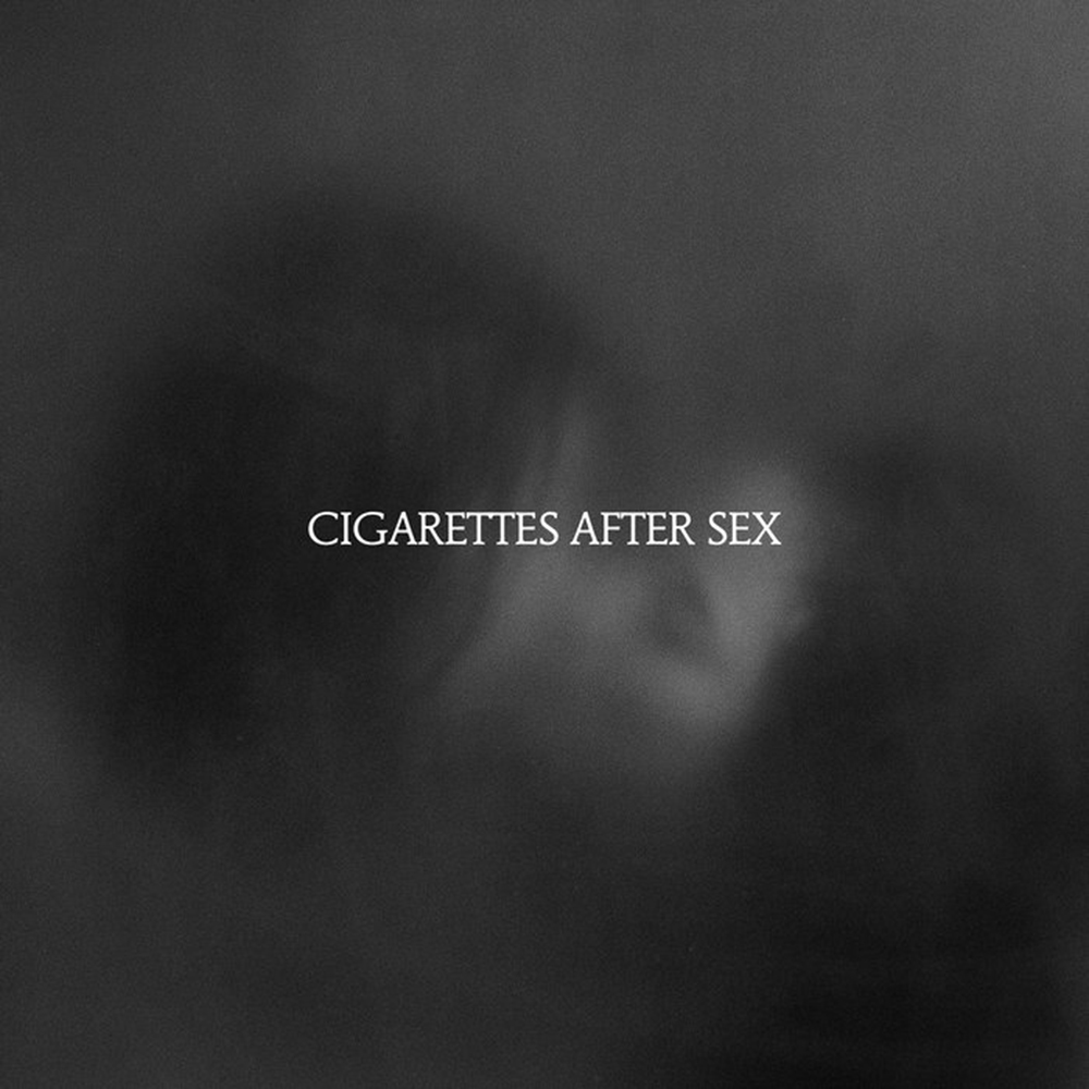 Photo: A picture of Cigarettes After Sex's album cover for "X's." It features a cloudy gray backround with the band's name on it.