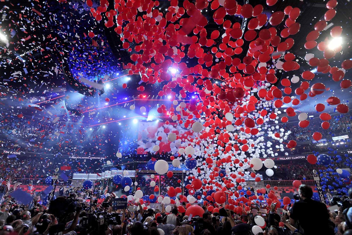 Photo: A picture of the Democratic National Convention at the Wells Fargo Center in Philadelphia, Pennsylvania. There is confetti pouring from the ceiling and balloons all around.