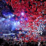 Photo: A picture of the Democratic National Convention at the Wells Fargo Center in Philadelphia, Pennsylvania. There is confetti pouring from the ceiling and balloons all around.