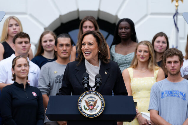 Photo: Kamala Harris, the vice president of the united states, standing in front of a large group of College Athletes at a recent speech on July 22, 2024