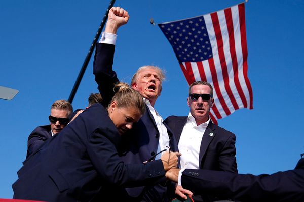 Photo: Republican presidential candidate former President Donald Trump is surrounded by U.S. Secret Service agents at a campaign rally