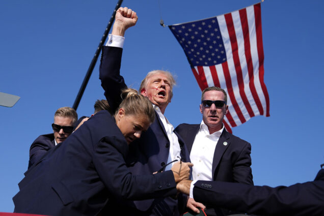 Photo: Republican presidential candidate former President Donald Trump is surrounded by U.S. Secret Service agents at a campaign rally