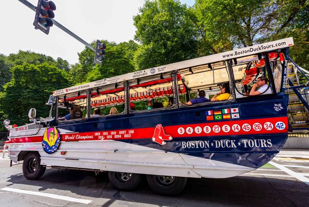 Photo: Boston Duck Boat Tour vehicle with passengers on a downtown Boston street. Boston Duck Tours is a privately owned company that operates historical tours of the city of Boston using renovated World War II amphibious DUKW (aka Duck) vehicles.