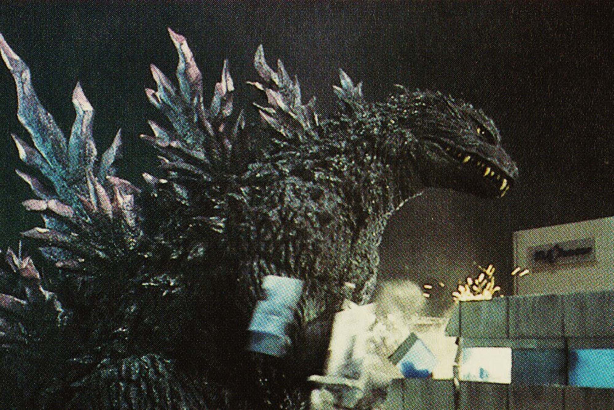 Photo: A movie still from "Godzilla 2000" featuring Godzilla causing destruction