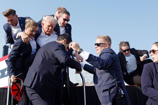 Photo: Republican presidential candidate former President Donald Trump is surrounded by U.S. Secret Service agents at a campaign rally