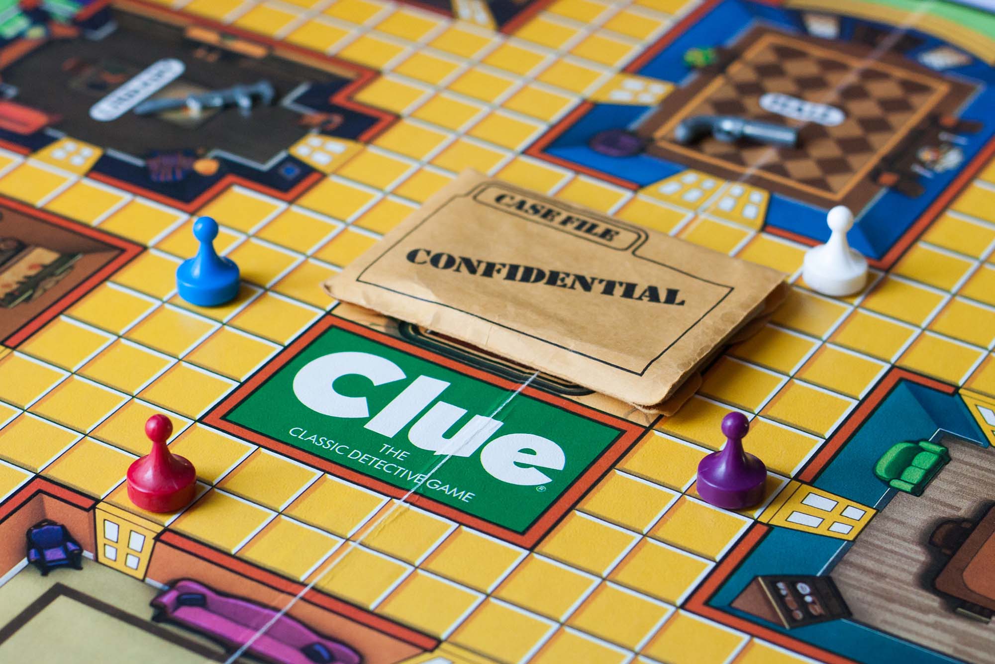 Photo: A picture of the board game "Clue: The classic detective game" with a confidential case file on it