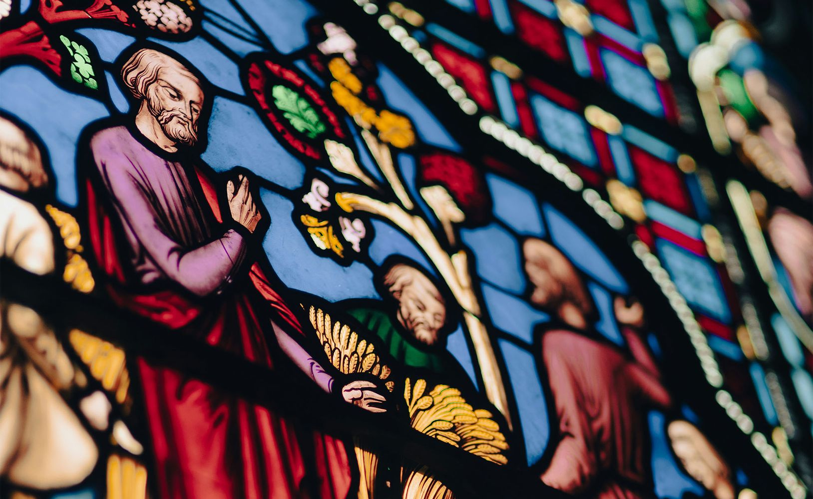 Photo: An elegant and colorful stained glass window in a church