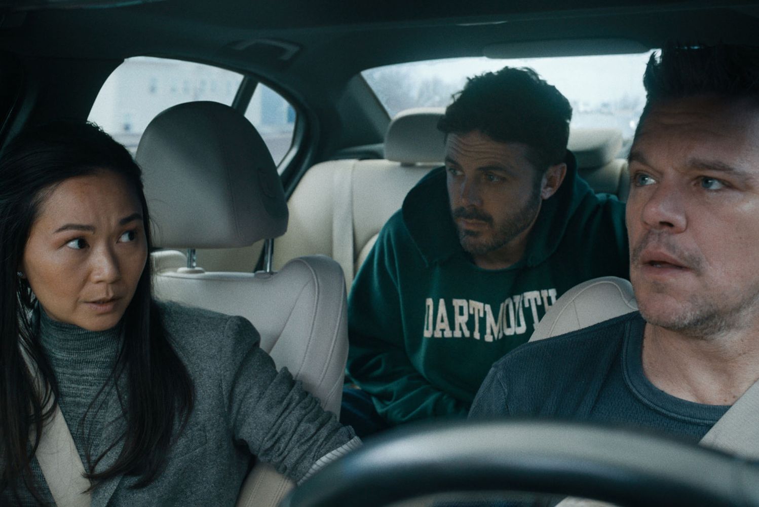 Photo: A still from "The Instigators" on Apple TV+ featuring Hong Chau(from left), Casey Affleck, and Matt Damon in a car