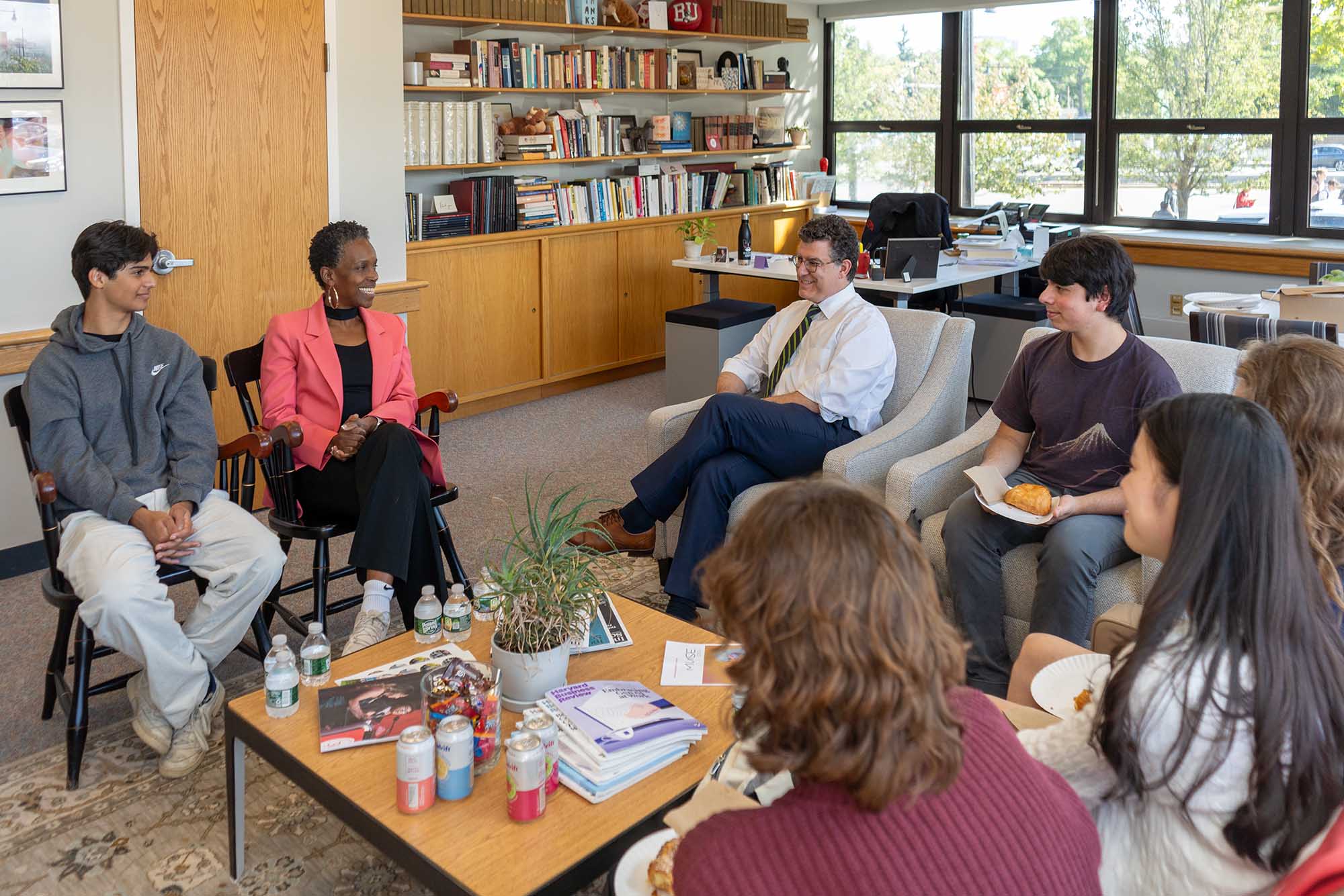 Photo: BU President Dr. Gilliam (second from left) in conversation with BUA students and Head of School Chris Kolovos.