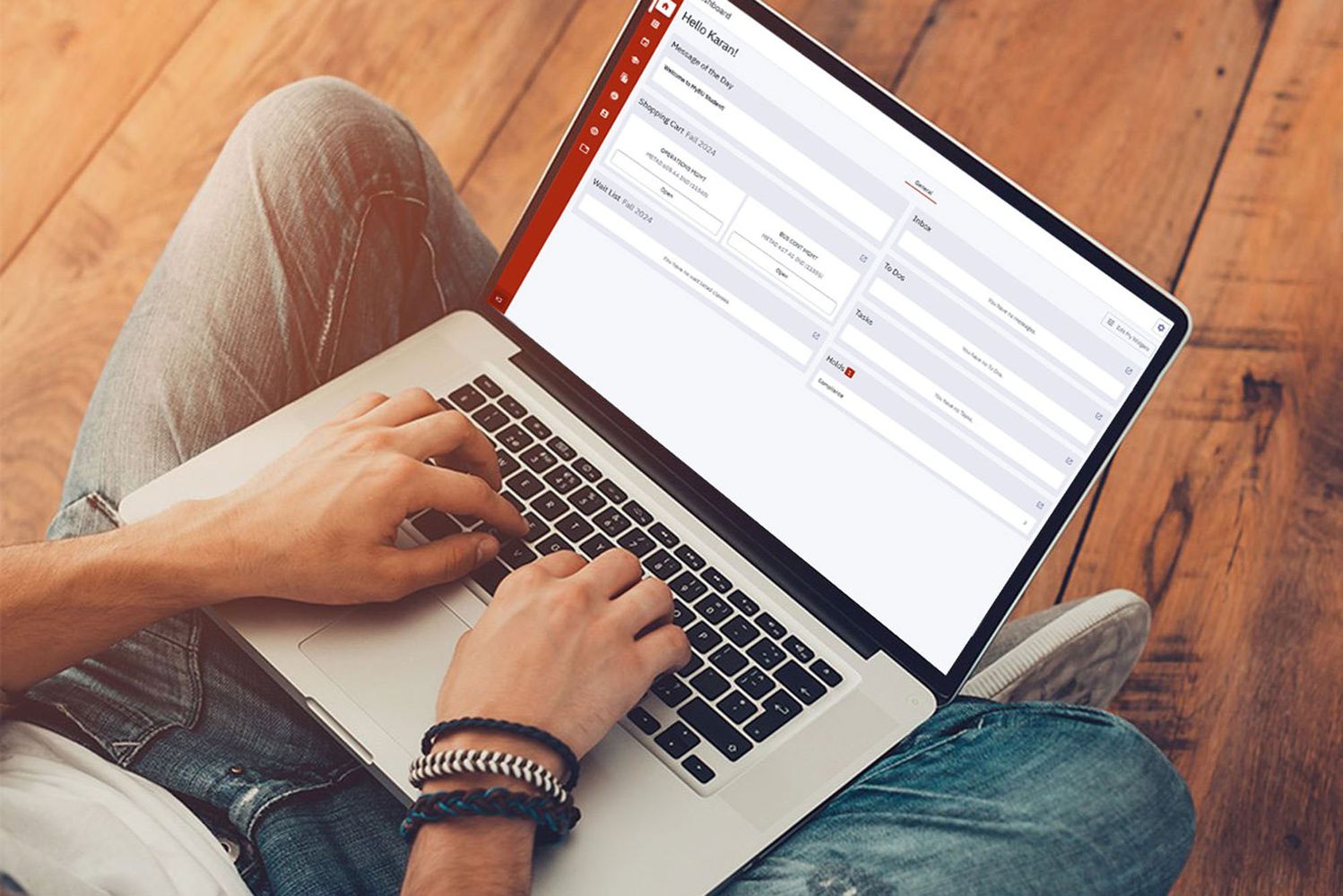 Photo: A laptop with a student typing on the webpage for Boston University's SIS Renewal Program