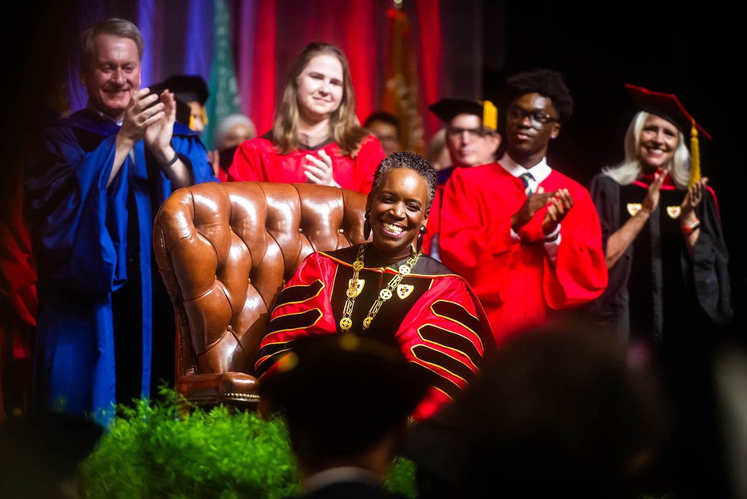 Photo: Melissa L. Gilliam sits in the leather chair that belonged to one of BU’s founders, Isaac Rich. The chair was used in 1869 when a petition was signed to charter BU as a new corporation.