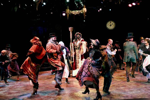 Photo: A group of people performing on stage for A Christmas Carol.