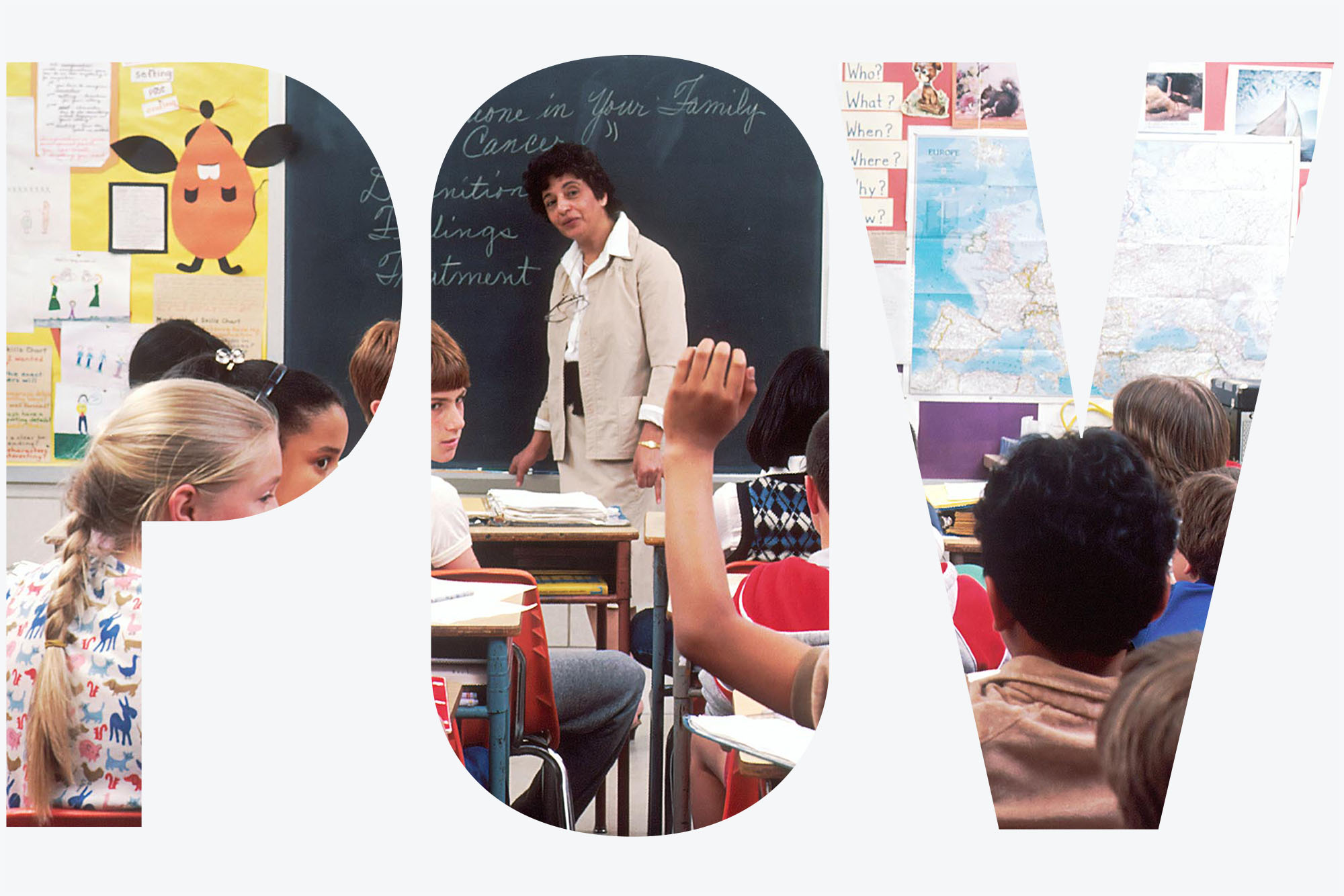 Photo: A stock photo of a classroom full with children, a lone child in the center raising his hand.
