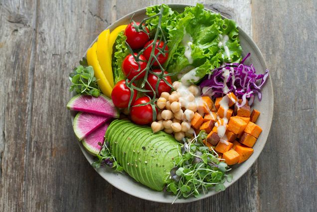 Photo: A plate of salad with colorful seasonal vegetables