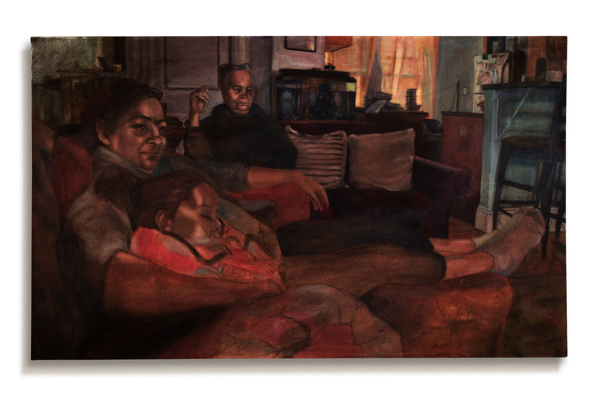 Photo: A painting of a family lounging on couches together. It is hung at a painting thesis exhibit