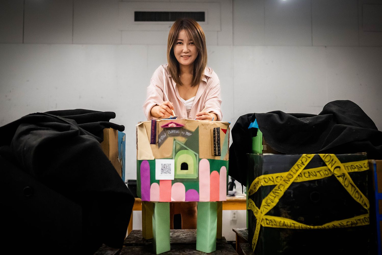 Photo: Jieun Lim (CFA’26), a master in arts education student, poses with some of her educational materials
