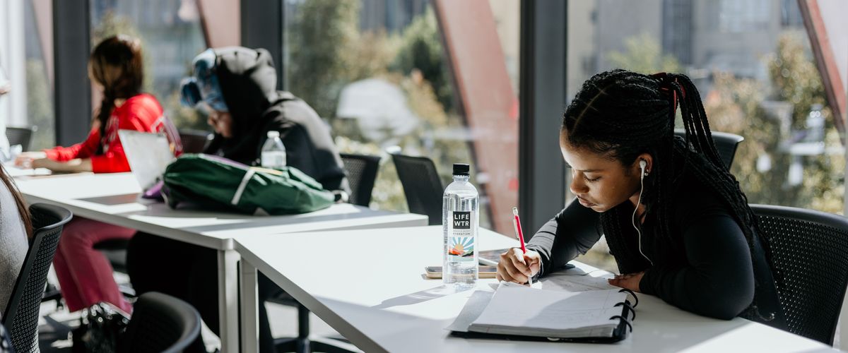 Students studying at tables