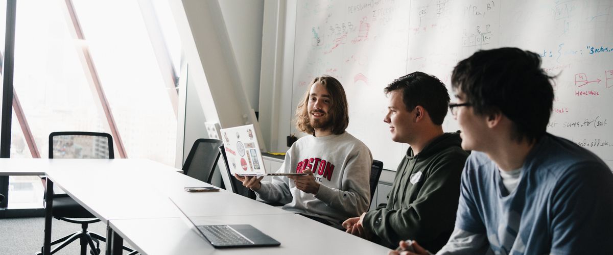 Students in a classroom together.