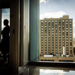 Photo: A picture of BU President Melissa Gilliam admiring the view from a campus building window