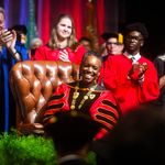 Photo: Melissa L. Gilliam sits in the leather chair that belonged to one of BU’s founders, Isaac Rich. The chair was used in 1869 when a petition was signed to charter BU as a new corporation.