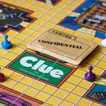 Photo: A picture of the board game "Clue: The classic detective game" with a confidential case file on it