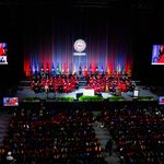 Photo: A Large crowd gathers in a dark arena to watch the inauguration of Melissa L Gilliam as Boston University's 11th President