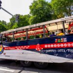 Photo: Boston Duck Boat Tour vehicle with passengers on a downtown Boston street. Boston Duck Tours is a privately owned company that operates historical tours of the city of Boston using renovated World War II amphibious DUKW (aka Duck) vehicles.