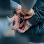 Photo: A stock image of someone being put in handcuffs.