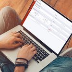 Photo: A laptop with a student typing on the webpage for Boston University's SIS Renewal Program