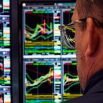 Photo: A specialist works at his post on the floor of the New York Stock Exchange