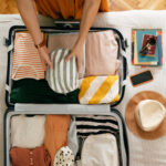 Photo: A picture of someone packing and organizing a suitcase for vacation