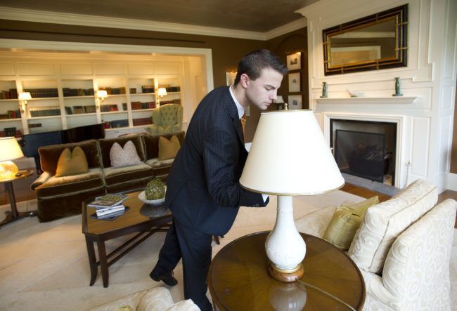 Sam Everett (SHA'11) does a walk-through at the Presidential Suite in the Four Seasons where he is a Housekeeping Supervisor. August 19, 2011. Photo by Cydney Scott  for Boston University Photography