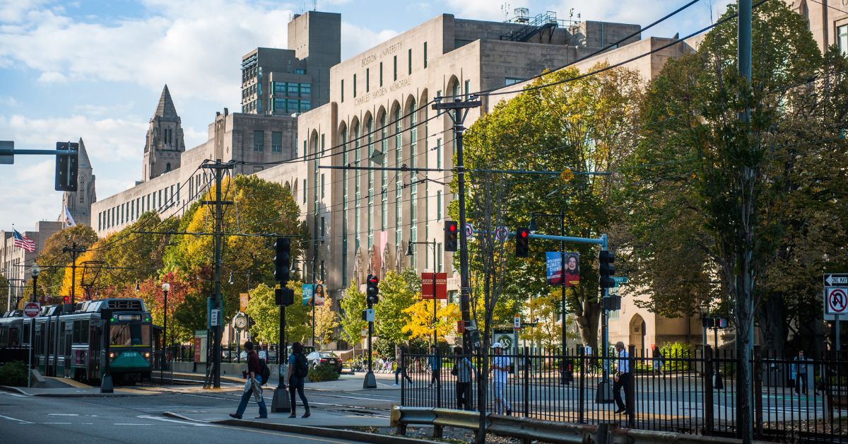 BU campus with green line train in foreground.
