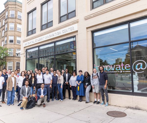 Group photo of students and employees standing outside IDG Capital Innovation Center