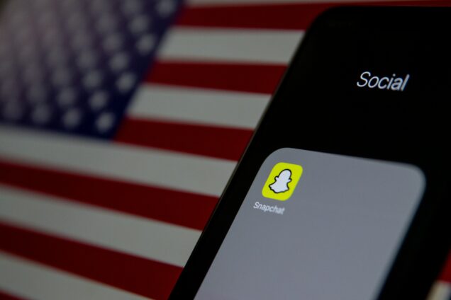 Snapchat on phone with American flag