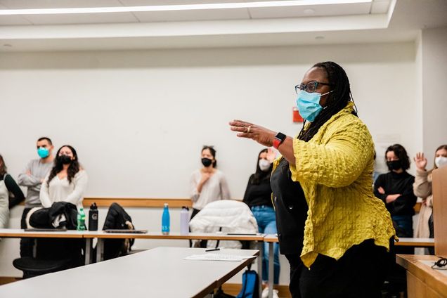 Dean Angela Onwuachi-Willig speaks in front of a classroom seminar