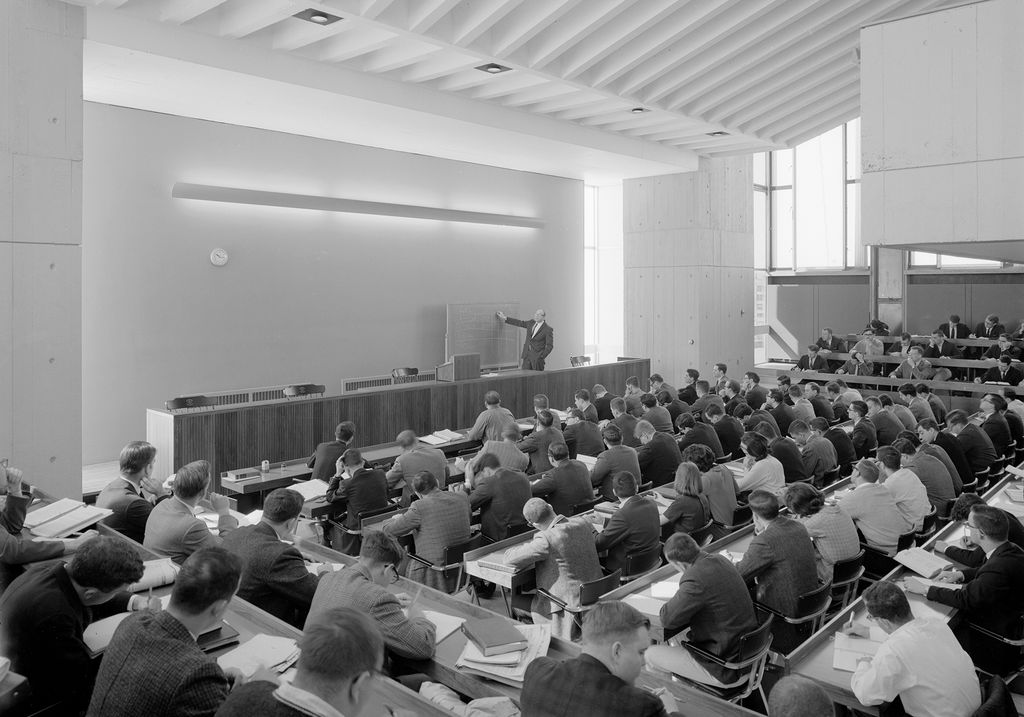 A 1964 black and white photo of Professor and Dean William Schwartz teaching one of the first classes in the law tower