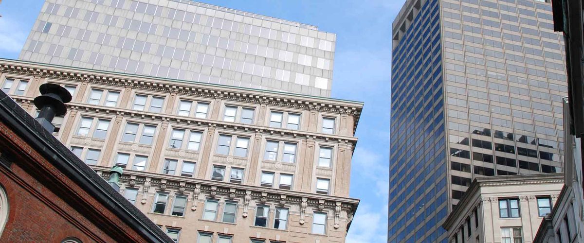 A view of several buildings from street level in downtown Boston