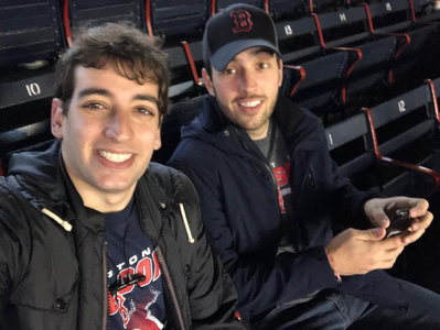 Catching a Boston Red Sox baseball game at world-famous Fenway Park.