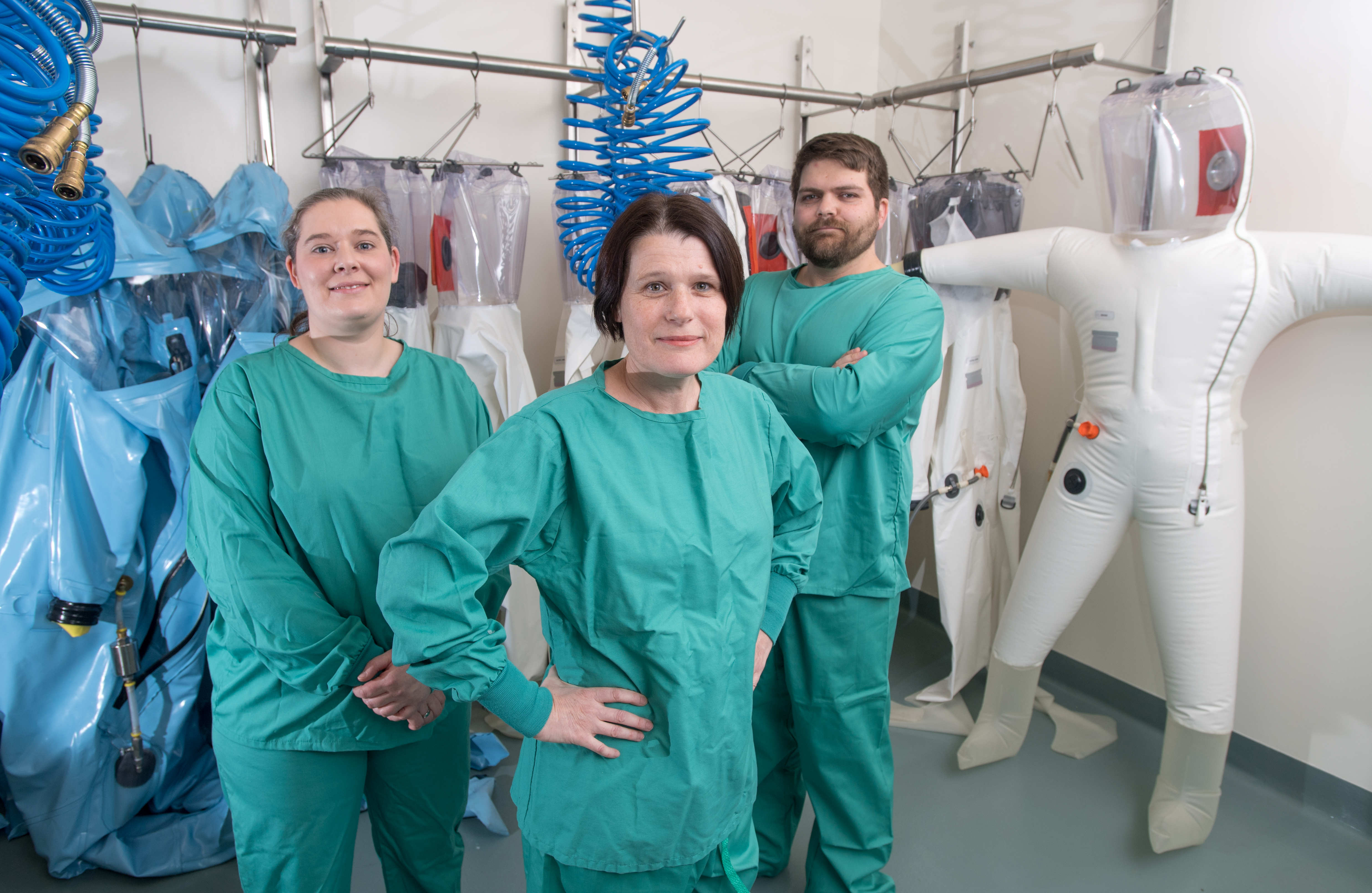 Leading Ebola and Marburg scientist Elke Muhlberger, center, and research scientists Adam Hume, at right, and Judith Yulenik.