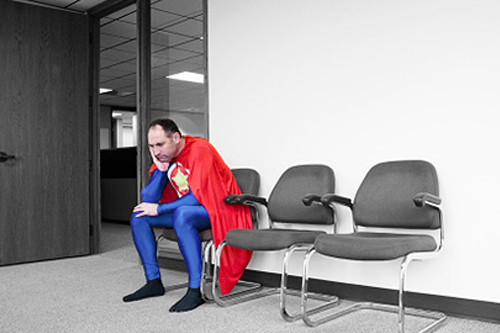 superhero sitting in chair