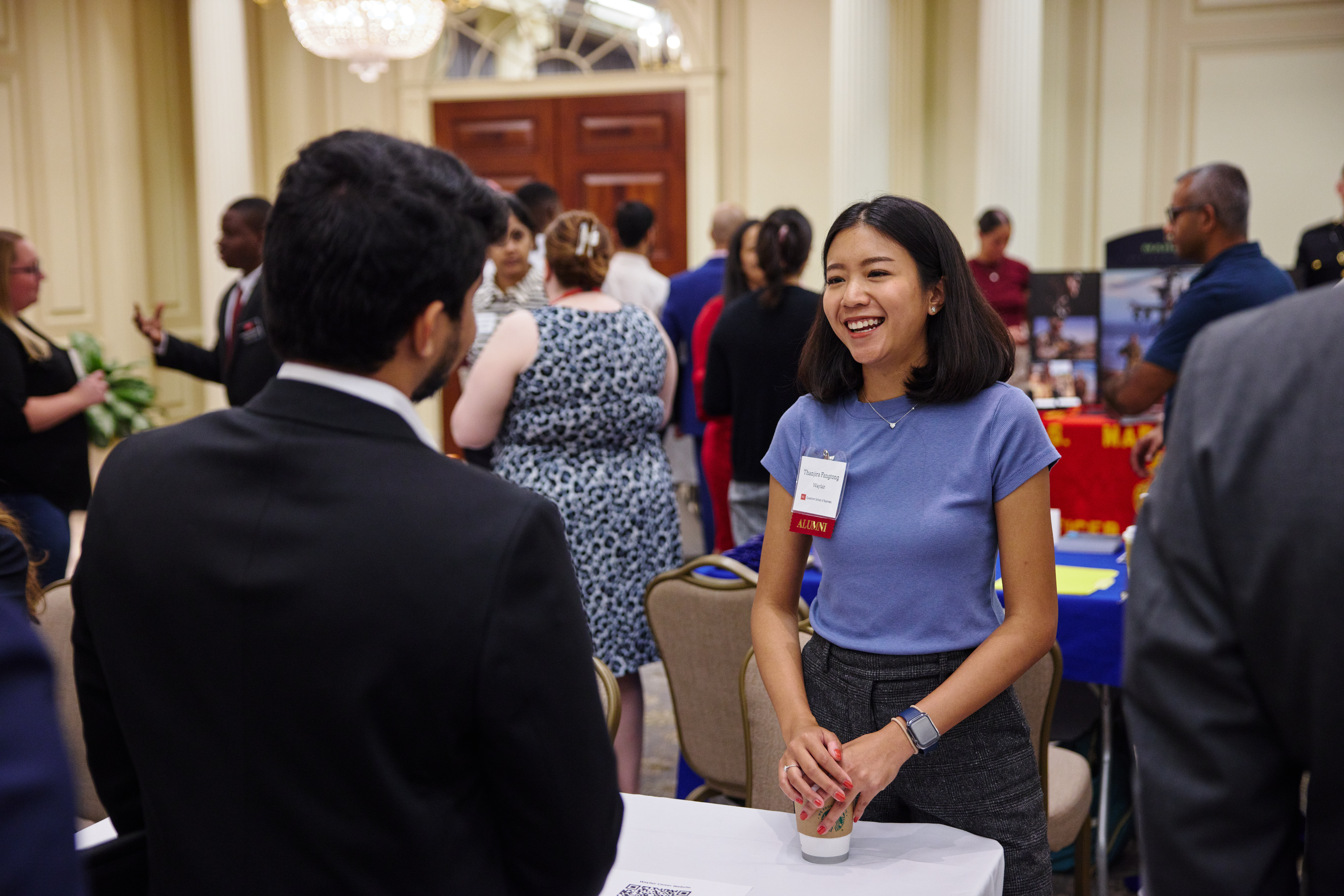 A student speaks with an employer at a career fair