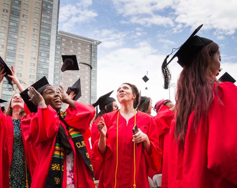 Students throwing their caps in the air at graduation