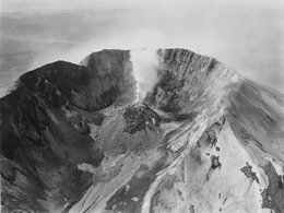Frank Gohlke, Aerial View: Looking South at Mount St. Helens Crater and Lava Dome, Mount Hood and Mount Jefferson in the Distance, Airplane in Crater, 1982, gelatin silver print, 30 x 40 in., courtesy of the artist.