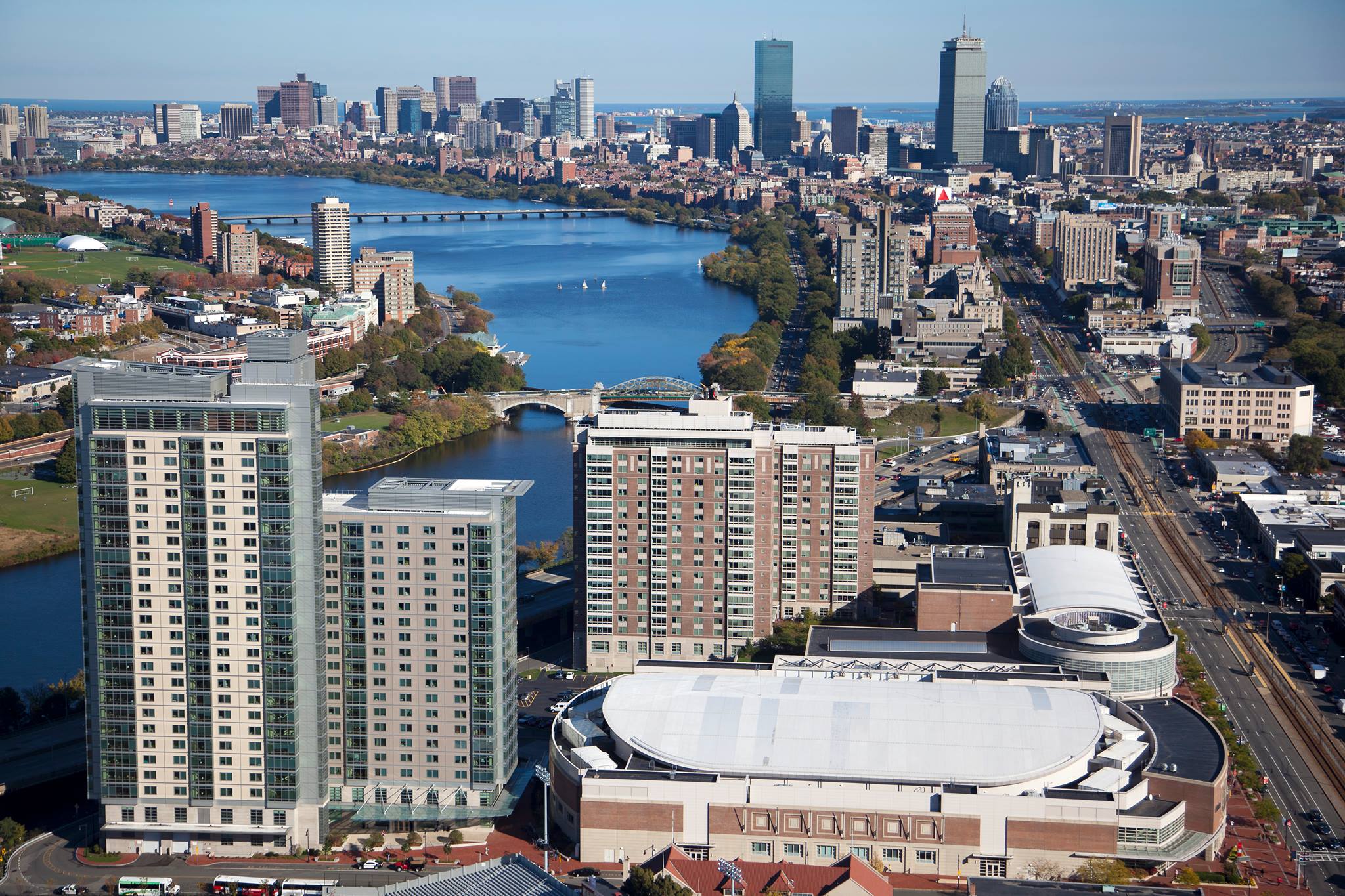 Aerial view of Boston with focus on BU campus from Agganis Arena up Commonwealth to Back Bay and the Charles River. Most of downtown Boston and the ocean are in the distance.